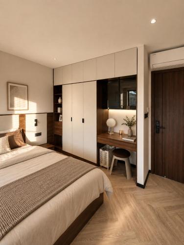 a bedroom with a bed and a desk in it at AMA Residences in Buon Ma Thuot