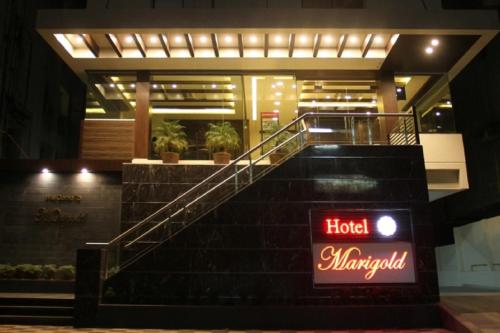 a hotel margaritaville sign in front of a building at Hotel Marigold in Vadodara