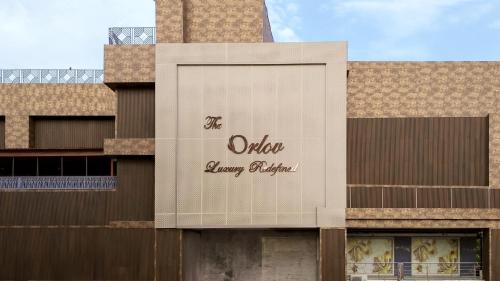 a sign on the side of a building at The Orlov in Babarpur
