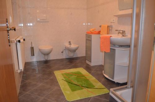 a bathroom with a sink and a toilet at Wastlhof in Malles Venosta
