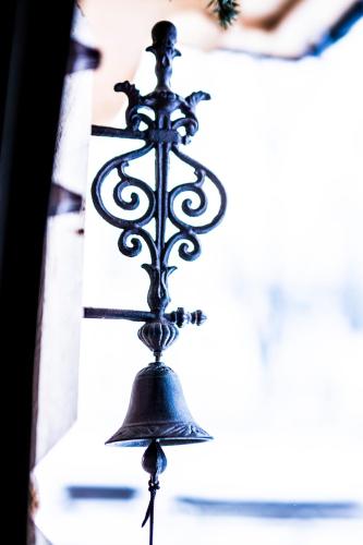 a bell hanging from the ceiling of a church at U Dziadka in Chochołów