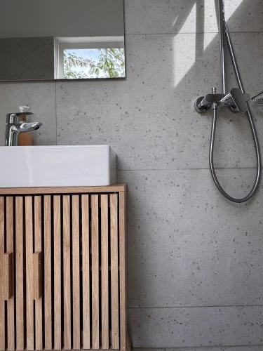 a bathroom with a sink and a shower at Casa Regina - 5min to Beach - Peaceful Retreat in Lithakia