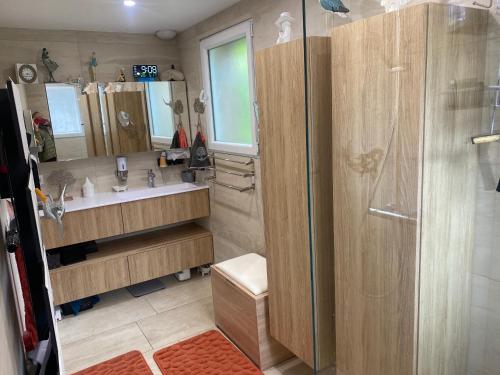 a bathroom with a shower and a sink at Arlette Guest House in Essarts