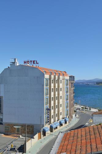 a hotel with a hotel sign on the top of it at Hotel Montemar *** Superior in O Grove