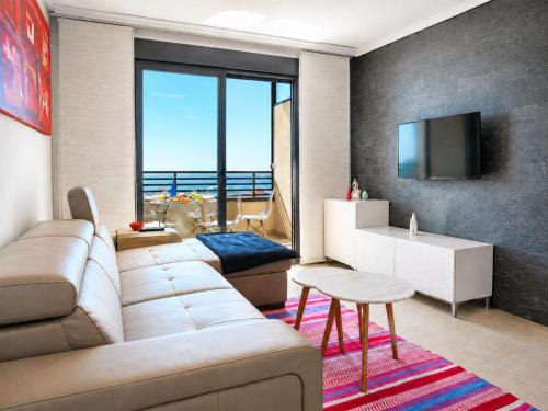 a living room with a couch and a table at Penthouse with Panoramic View Santa Pola in Santa Pola