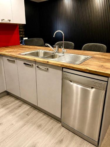 a kitchen with a sink and a counter at The Crossing Lodge in National Park