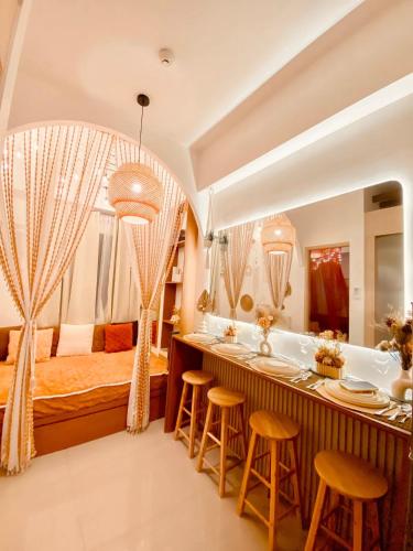 a hotel room with a tub and a bed at Hiraya Luna in Manila