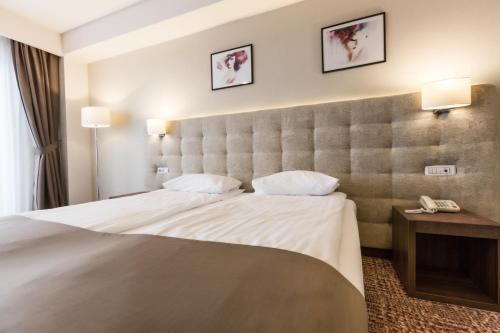 Katil atau katil-katil dalam bilik di Grand Hotel Belvedere