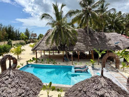 an aerial view of a resort with a swimming pool at Pamoja Villas in Migogoni