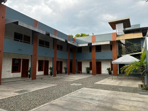 a large building with a courtyard in front of it at Villa Acuario in Tapachula