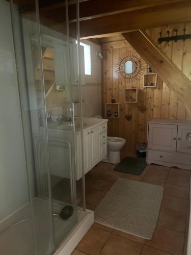 a bathroom with a sink and a toilet at La Salamandre in Valprivas