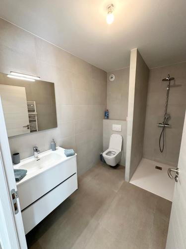 a bathroom with a sink and a toilet at Suarina in Porto-Vecchio