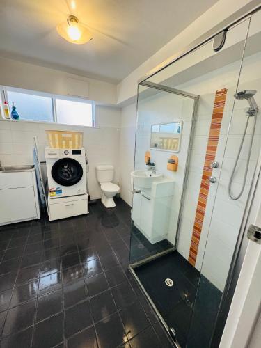 a bathroom with a shower and a toilet and a sink at Sea Breeze with City Ease in Port Lincoln