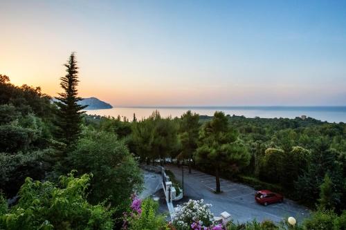 a car parked in a parking lot in front of the ocean at Hotel Internazionale in Ancona
