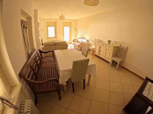 a dining room with a table and chairs in a room at charmante apartament lake front in Malcesine