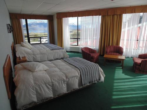 Postel nebo postele na pokoji v ubytování Hotel HD Natales