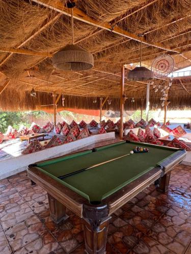 a pool table in a pavilion with a pool table at Relax Beach Camp in Nuweiba