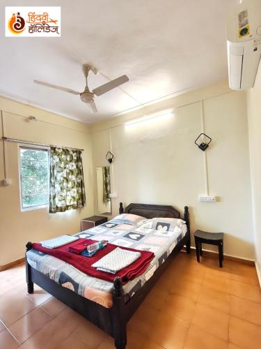 a bedroom with a bed in a room at Hotel Shahi Residency in Panhāla