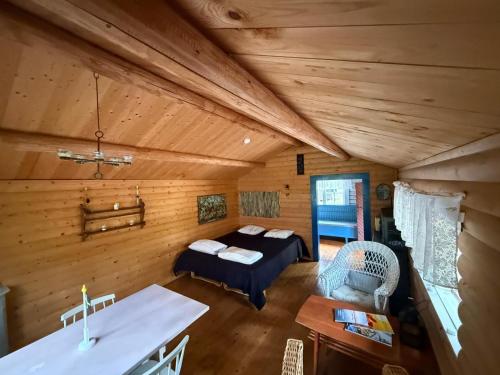 a bedroom with a bed and a table in a room at Byron in Rälla