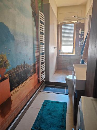 a bathroom with a shower and a toilet and a sink at Sole di Vita in Marina di Strongoli