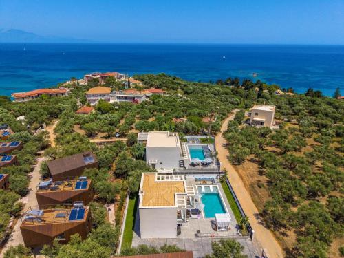 an aerial view of a house and the ocean at Christian Luxury Villa in Tsilivi