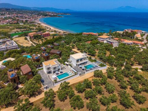 an aerial view of a villa and the ocean at Christian Luxury Villa in Tsilivi