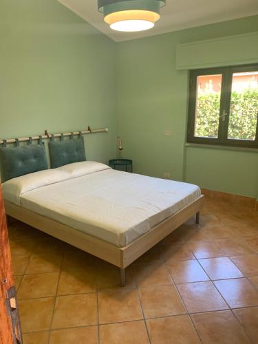 a bedroom with a large bed in a room at Roma country resort in Rome