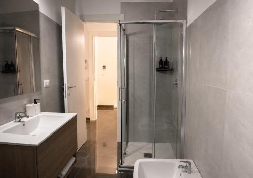 a bathroom with a shower and a sink at Reale Guest House in Mascalucia