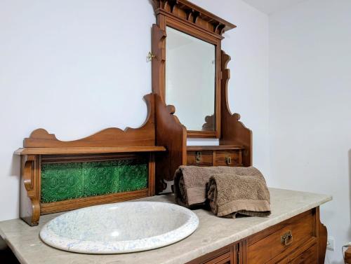 a bathroom with a large sink and a mirror at Casas Telhadas in Trancoso
