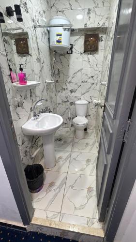 a bathroom with a sink and a toilet at Istanbul HOTEL Minya in Minya