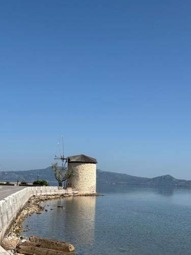 a building on the side of a body of water at Modern Villa in Lesvos in Apidias Lakos