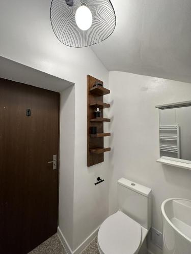 a bathroom with a toilet and a sink at Cismigiu Apartments in Bucharest