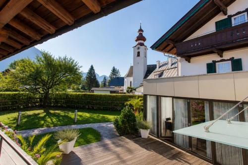 a view of the garden from the balcony of a house at Villa Egger in Lofer