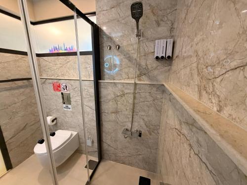 a bathroom with a shower with a toilet at Ya Bayté in Beirut