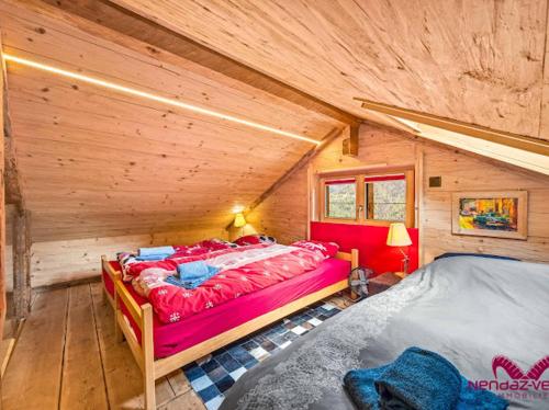 a bedroom with two beds in a log cabin at Charmant chalet authentique de montagne Bleusy- Nendaz idéal couple et famille in Saclentse