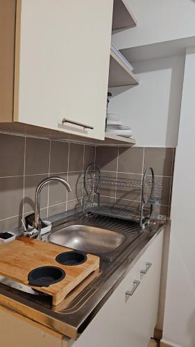 a kitchen with a sink and a counter top with a sink at L'Interlude in Saint-Denis