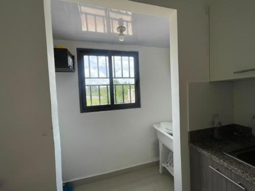 a kitchen with a window on the wall at Apartment With Swimming Pool close to Beach in La Romana