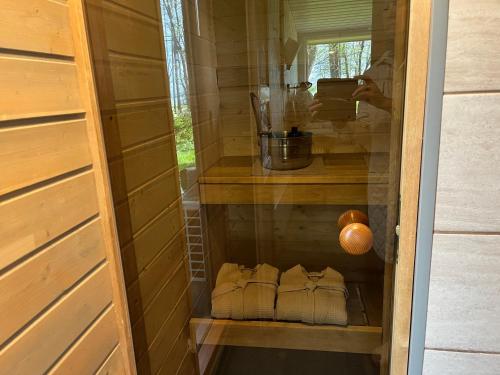 a cabinet in a house with shoes in it at sun& relax- TINYHOUSE in Sõitme