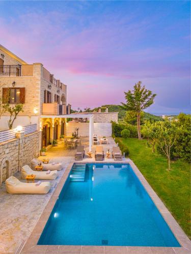 a pool in the backyard of a house at Spartakos Villa Resort - Slow Living Retreat collections With Private Pools in Planos