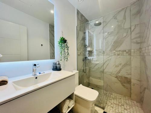 a bathroom with a sink and a shower at Cana Rock in Punta Cana