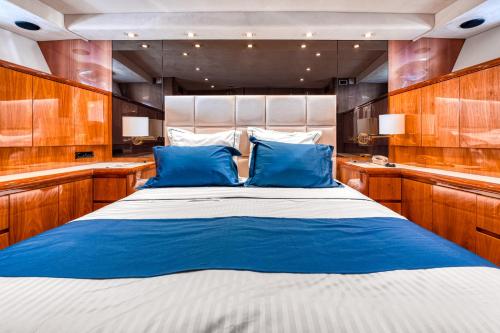 a bedroom with a large bed in a boat at Yacht FALCON FIVE in Cannes