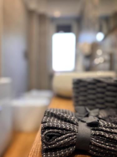a black tie sitting on top of a table at Maison Trentasette in Potenza