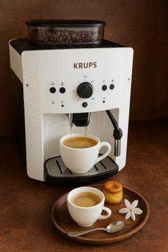 a coffee maker with a cup of coffee on a plate at El Ladrón De Agua Palacete in Granada