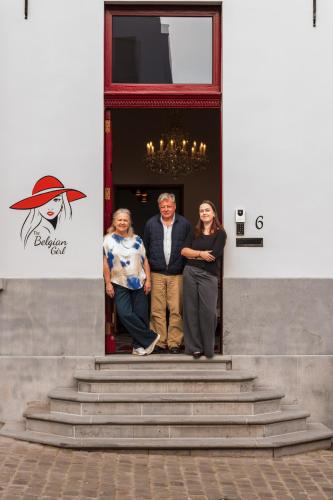 a group of people standing in the doorway of a building at Luxury B&B The Belgian Girl in Ghent