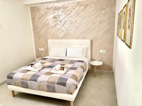 a bedroom with a bed with two towels on it at Ca' Gregolina in Venice