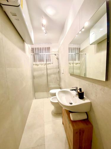 a bathroom with a sink and a toilet at Ca' Gregolina in Venice