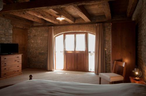 Ένα ή περισσότερα κρεβάτια σε δωμάτιο στο Agriturismo Sant'Egidio