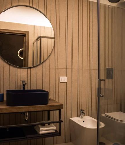 a bathroom with a sink and a mirror at B&B in centro in Eboli