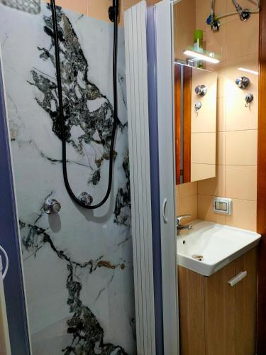 a bathroom with a shower and a sink at casa vacanze Libeccio parcheggio privato in Sapri