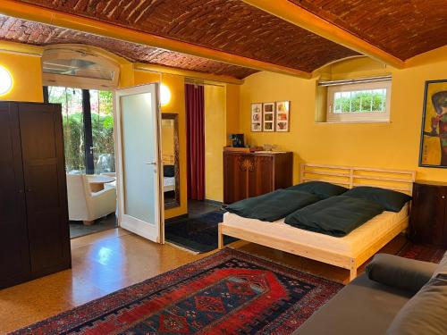 a bedroom with a bed and a living room at Bei Poldi in Paldau